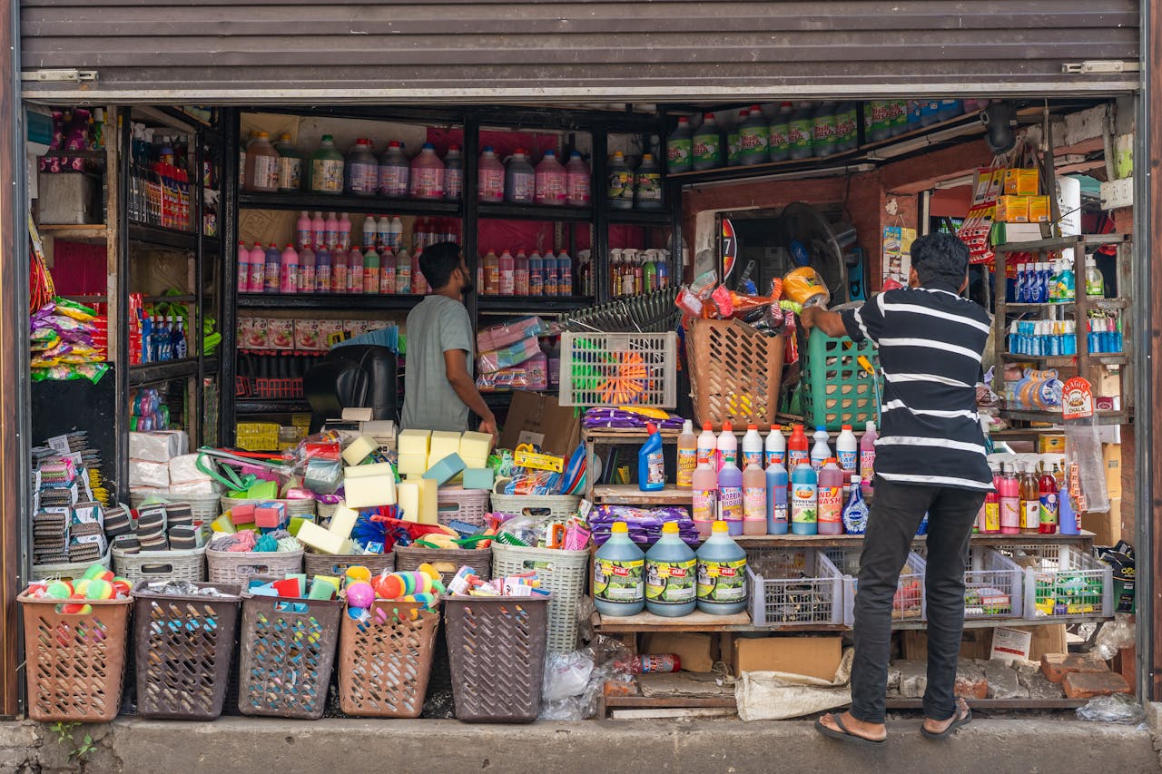 Vibrant street shop in Colombo selling cleaning products and household items.